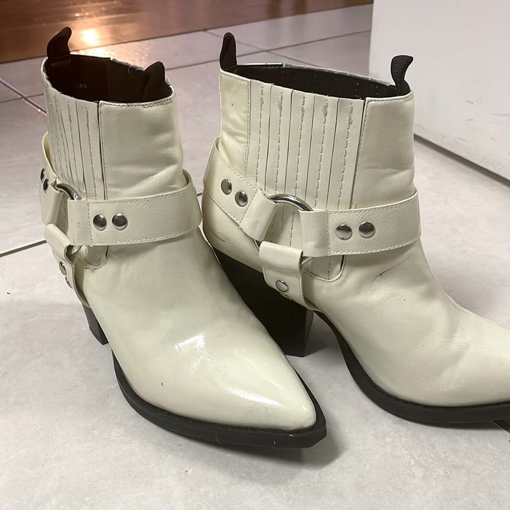 White faux leather ankle boots.